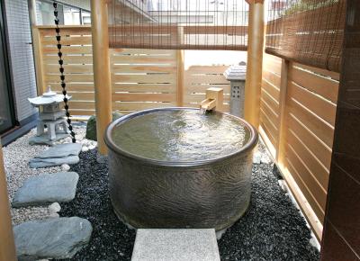 photo of a japanese clay tub full of water