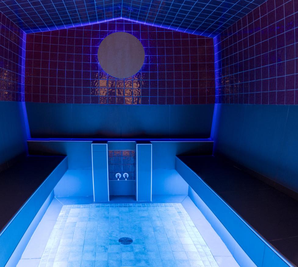 photo of steam room in red lighting