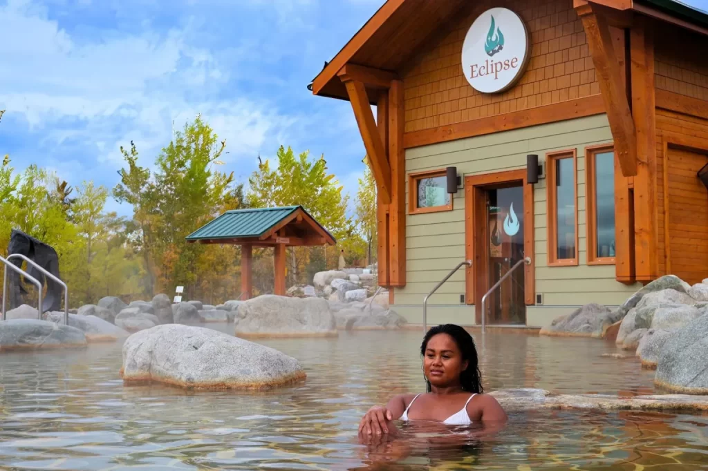 woman lounging in a natural hot spring